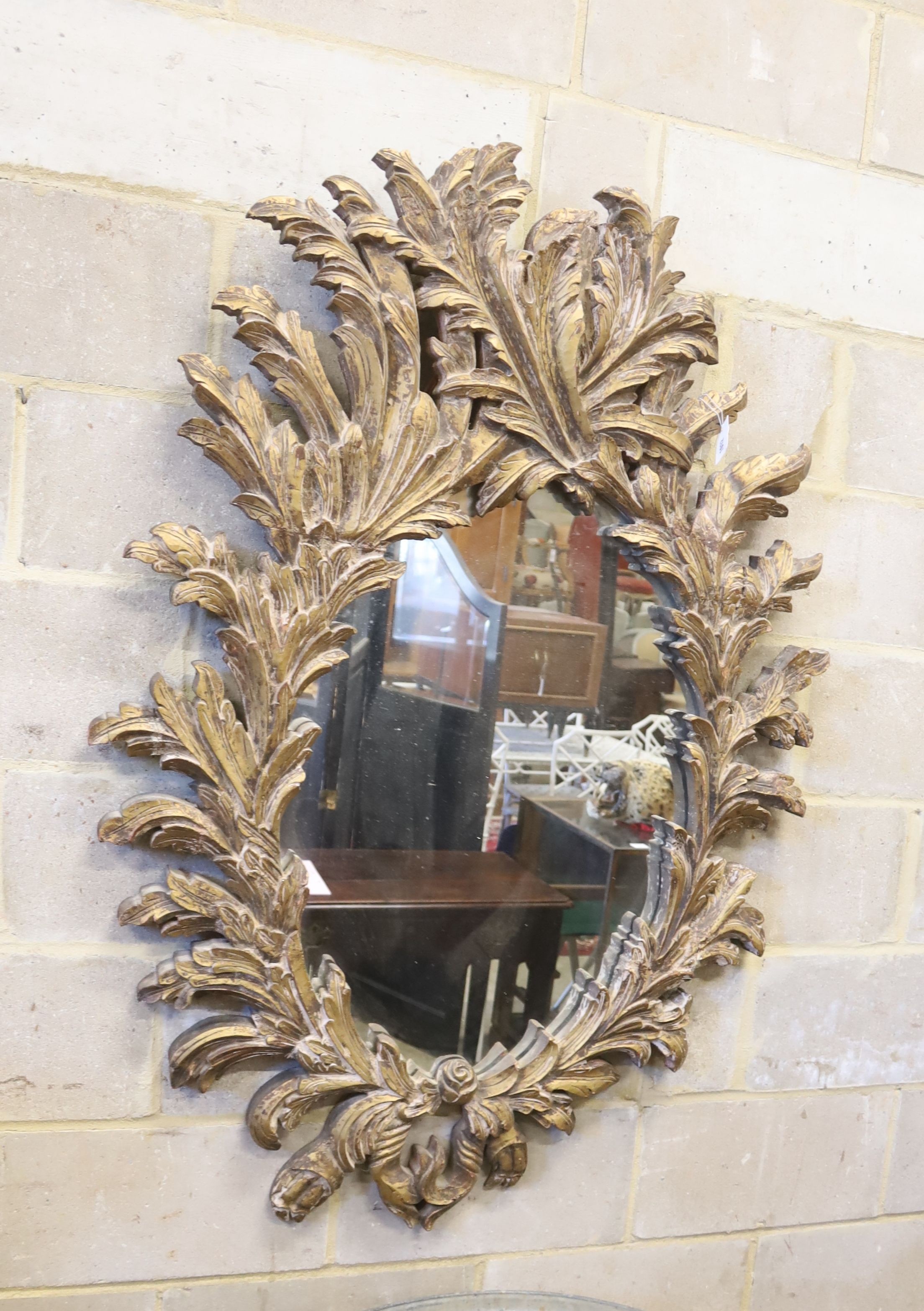 An 18th century style gilt acanthus framed wall mirror, width 100cm, height 140cm